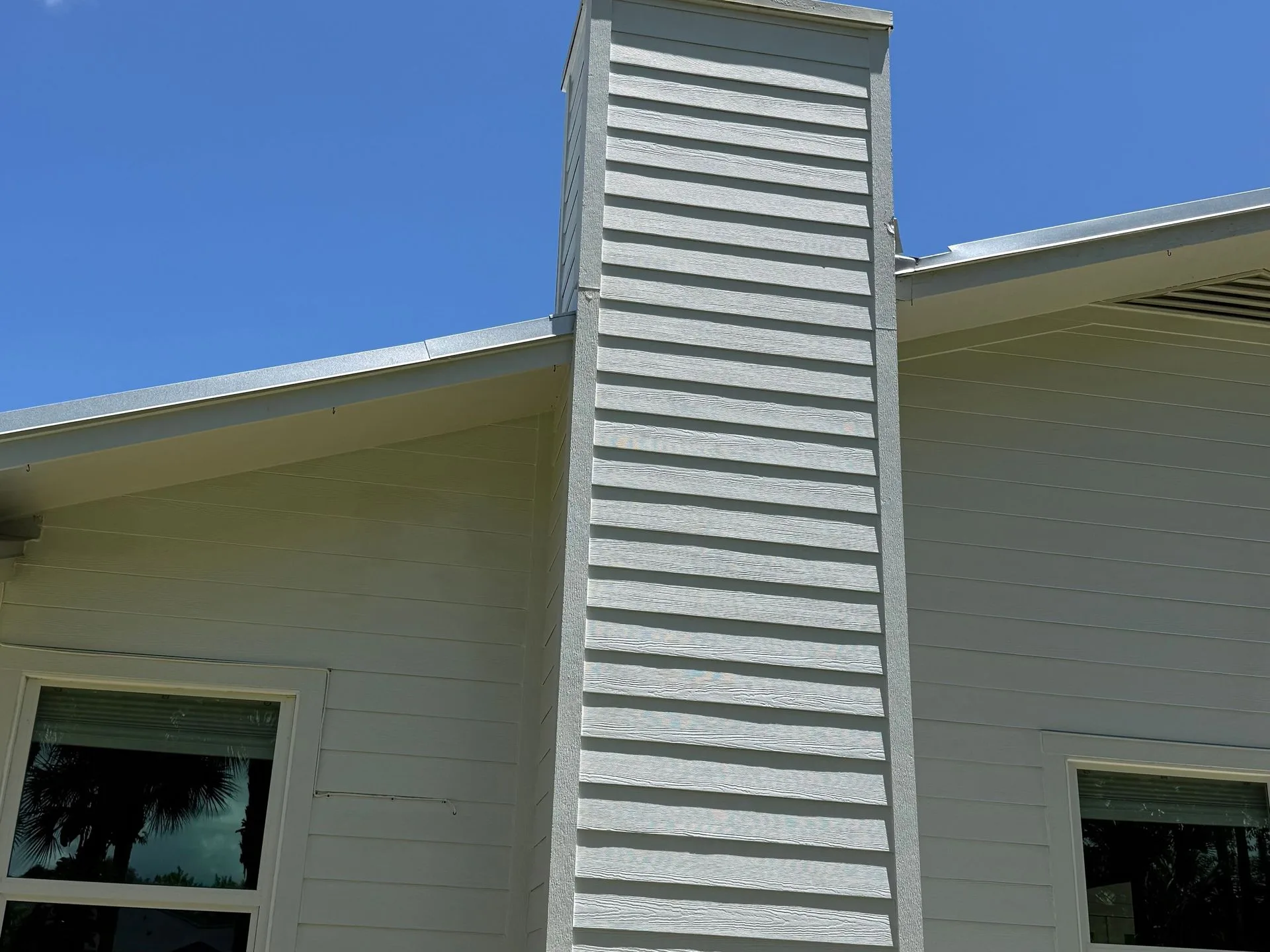 After: bright white chimney and siding