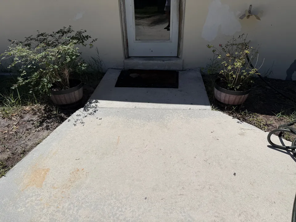 Bright, clean concrete walkway and front step